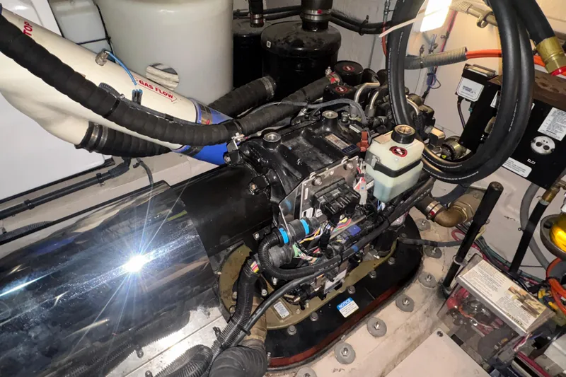 Skalywag VI Yacht Photos Pics Engine compartment of a 2015 Sea Ray 470 Sundancer, showcasing mechanical components and wiring.