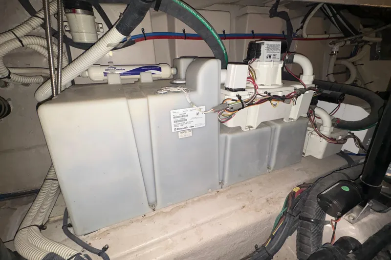 Skalywag VI Yacht Photos Pics Engine room of 2015 Sea Ray 470 Sundancer with wiring and equipment.