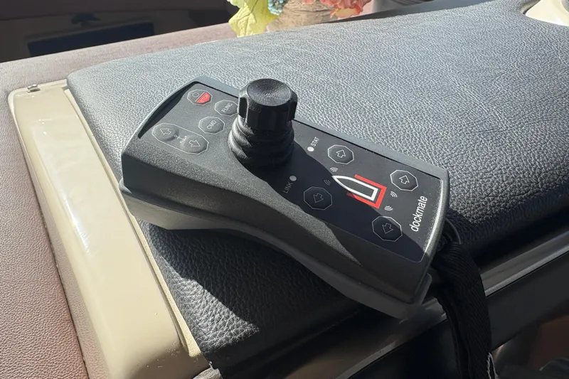 Skalywag VI Yacht Photos Pics Control panel of a 2015 Sea Ray 470 Sundancer boat, featuring Dockmate joystick.