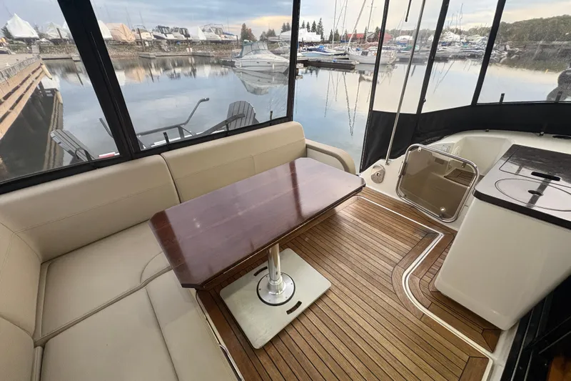 Skalywag VI Yacht Photos Pics Luxurious 2015 Sea Ray 470 Sundancer yacht interior with elegant seating and wooden table.
