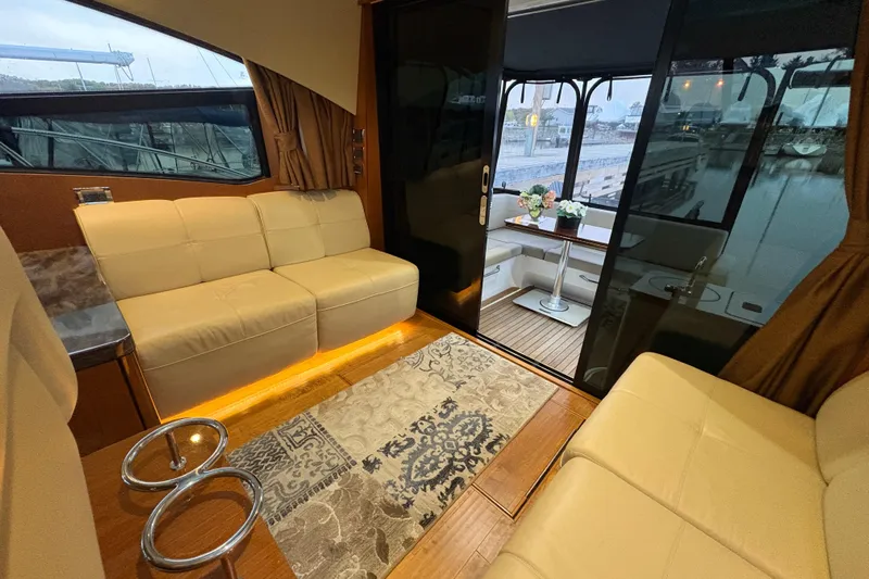 Skalywag VI Yacht Photos Pics Luxurious interior of 2015 Sea Ray 470 Sundancer yacht with elegant seating and decor.