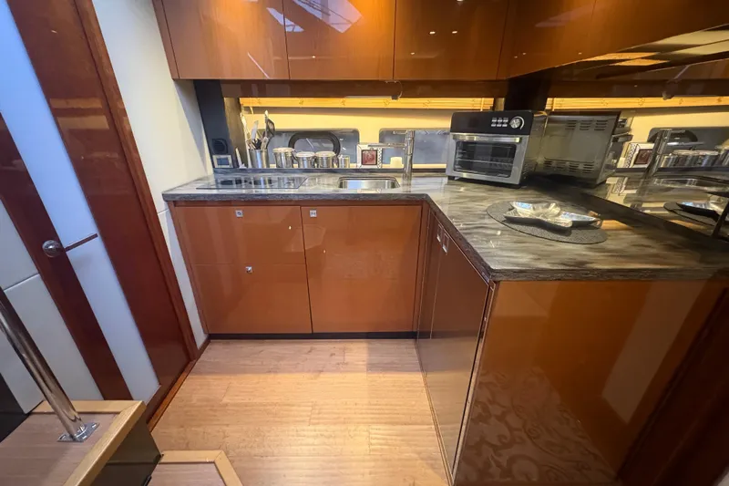 Skalywag VI Yacht Photos Pics Luxurious kitchen interior of 2015 Sea Ray 470 Sundancer yacht with modern appliances.