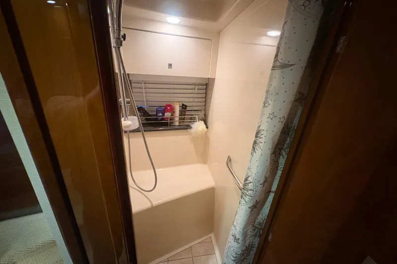 Skalywag VI Yacht Photos Pics Luxurious bathroom in 2015 Sea Ray 470 Sundancer yacht with shower and elegant decor.