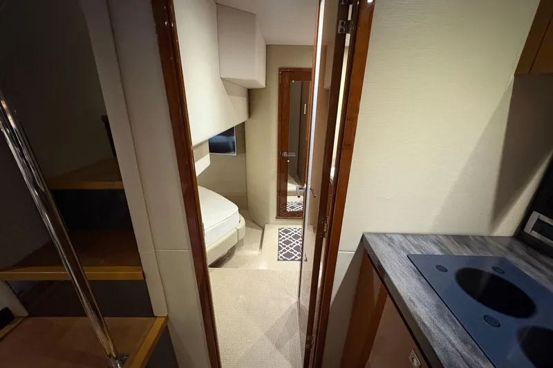 Skalywag VI Yacht Photos Pics Interior of 2015 Sea Ray 470 Sundancer yacht, featuring a cozy cabin and modern kitchenette.