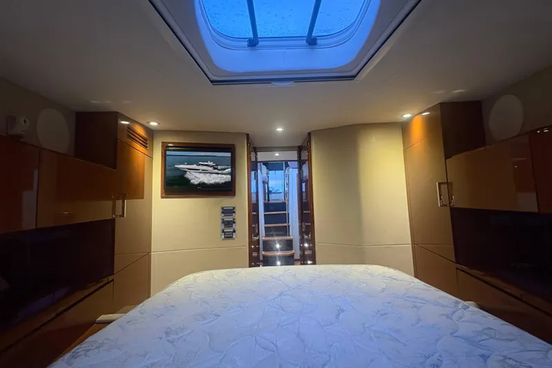 Skalywag VI Yacht Photos Pics Luxurious 2015 Sea Ray 470 Sundancer cabin interior with skylight and elegant wood finishes.