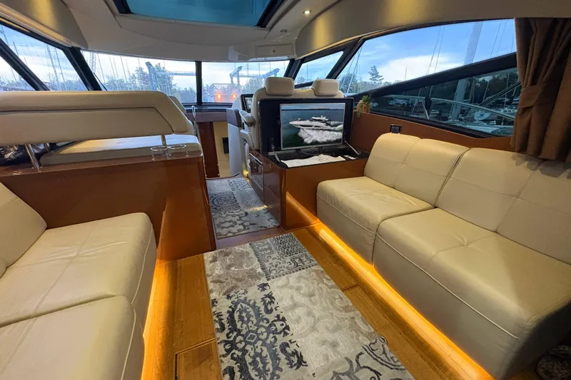 Skalywag VI Yacht Photos Pics Luxurious interior of 2015 Sea Ray 470 Sundancer yacht with elegant seating and ambient lighting.