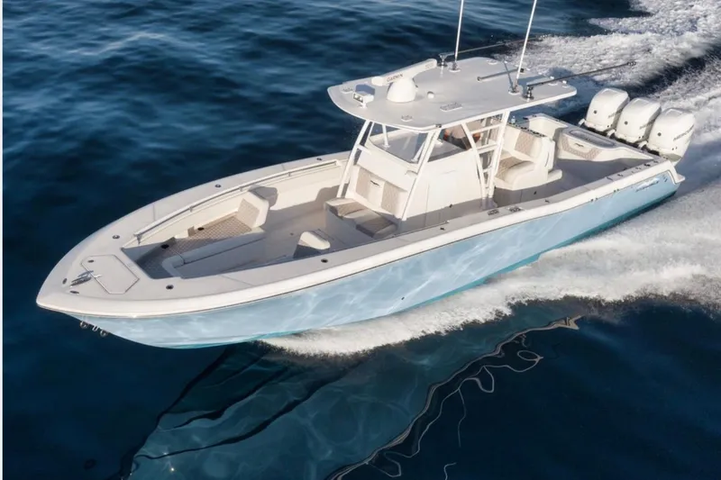  Yacht Photos Pics 2020 Invincible 36 Open Fisherman boat cruising on open water.