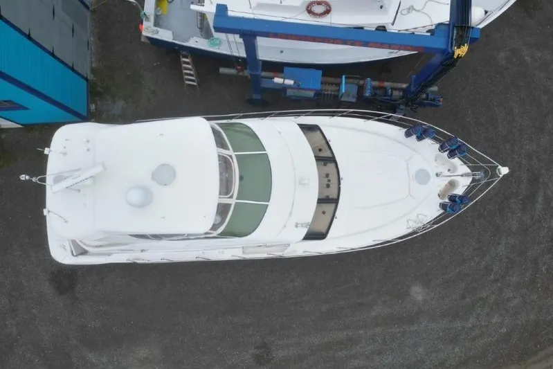  Yacht Photos Pics Aerial view of a 2004 Carver 450 Voyager Pilothouse yacht in a boatyard.