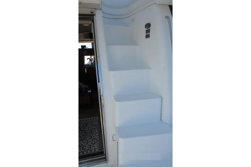  Yacht Photos Pics Staircase on 2004 Carver 450 Voyager Pilothouse yacht, leading to upper deck.