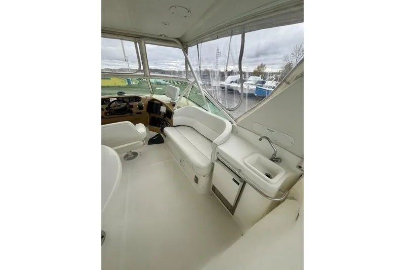  Yacht Photos Pics 2004 Carver 450 Voyager Pilothouse interior with helm, seating, and sink.
