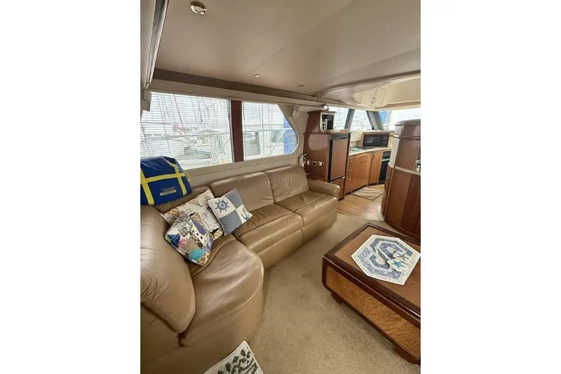  Yacht Photos Pics Luxurious interior of 2004 Carver 450 Voyager Pilothouse with leather seating and modern amenities.