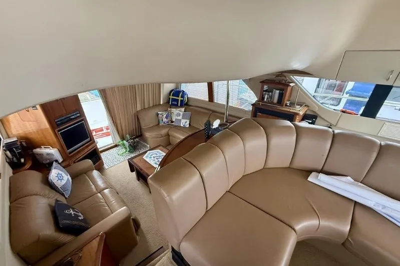  Yacht Photos Pics Luxurious interior of 2004 Carver 450 Voyager Pilothouse with leather seating and entertainment area.