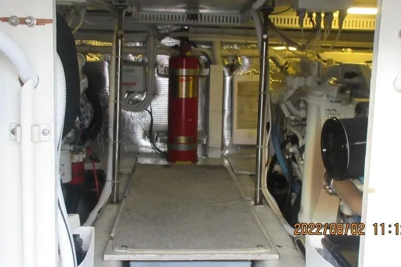  Yacht Photos Pics Engine room of 2004 Carver 450 Voyager Pilothouse with fire extinguisher and equipment.