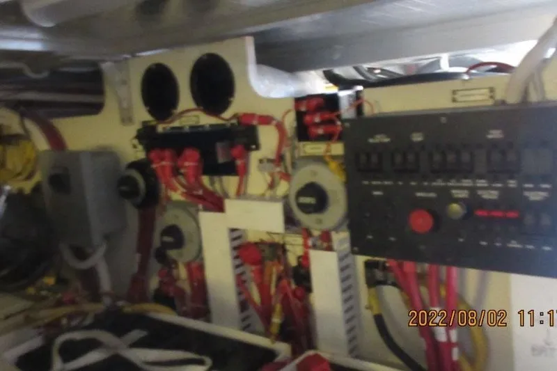  Yacht Photos Pics Electrical panel inside 2004 Carver 450 Voyager Pilothouse boat, showing wiring and controls.