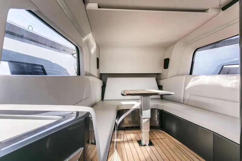  Yacht Photos Pics Luxurious interior of 2026 Maori Yacht with sleek seating and modern table design.