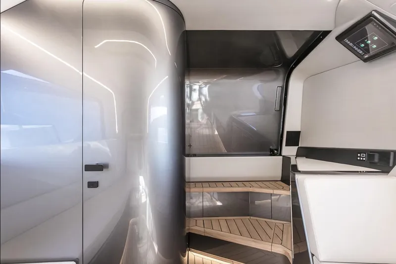  Yacht Photos Pics Futuristic interior of 2026 Maori Yacht with sleek design and modern staircase.
