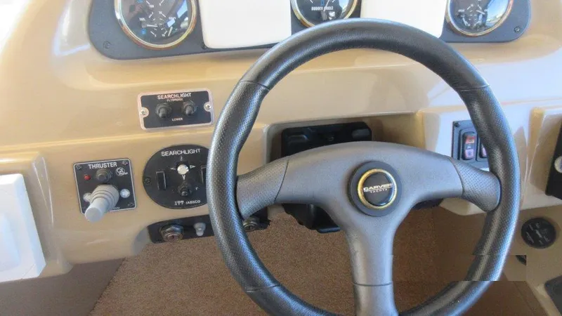  Yacht Photos Pics Steering wheel and controls of 2004 Carver 450 Voyager Pilothouse yacht.