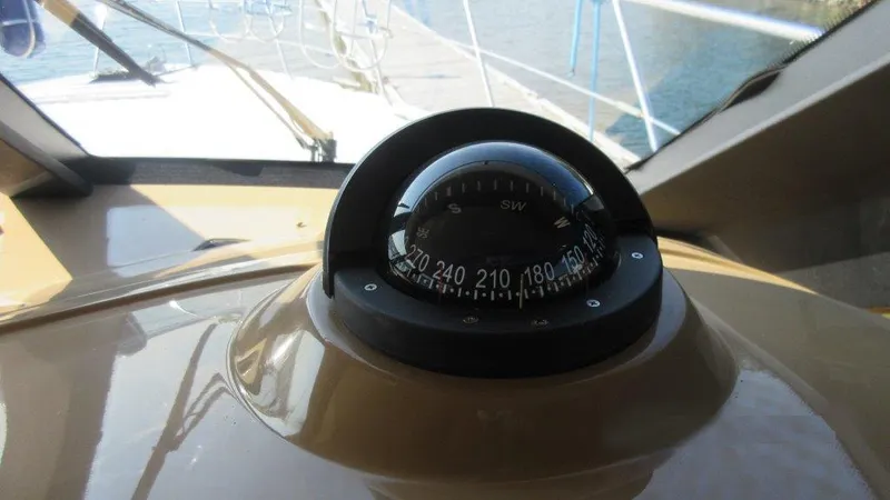  Yacht Photos Pics Compass on 2004 Carver 450 Voyager Pilothouse yacht, docked by the water.