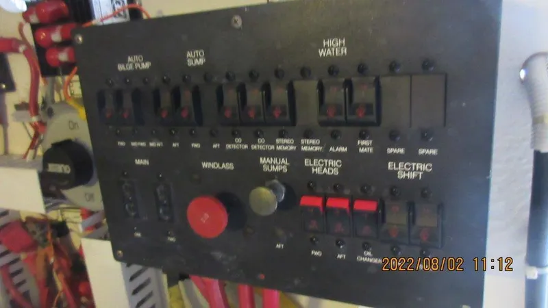  Yacht Photos Pics Control panel of a 2004 Carver 450 Voyager Pilothouse with various switches and indicators.