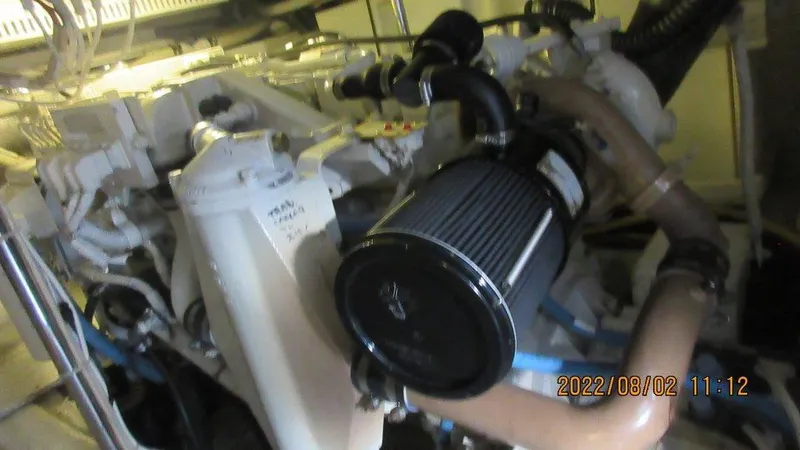  Yacht Photos Pics Engine room of 2004 Carver 450 Voyager Pilothouse with visible components and piping.