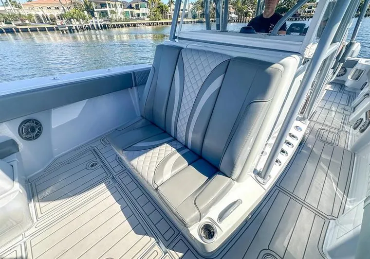 Fortuna Yacht Photos Pics 2021 SeaVee 370z boat interior with gray cushioned seating and sleek design.