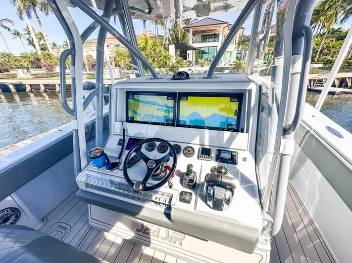 Fortuna Yacht Photos Pics 2021 SeaVee 370z boat cockpit with dual navigation screens and modern controls.