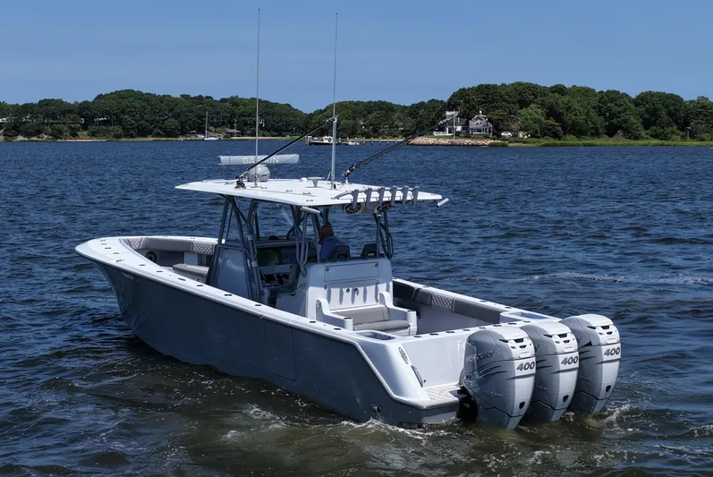 Fortuna Yacht Photos Pics 2021 SeaVee 370z boat with triple Mercury 400 engines on a calm lake.