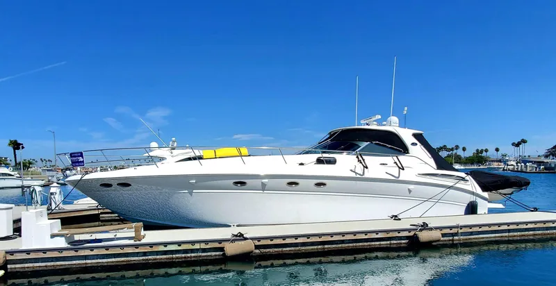 Sunbear Express Yacht Photos Pics 2001 Sea Ray 510 Sundancer yacht docked in a sunny marina.