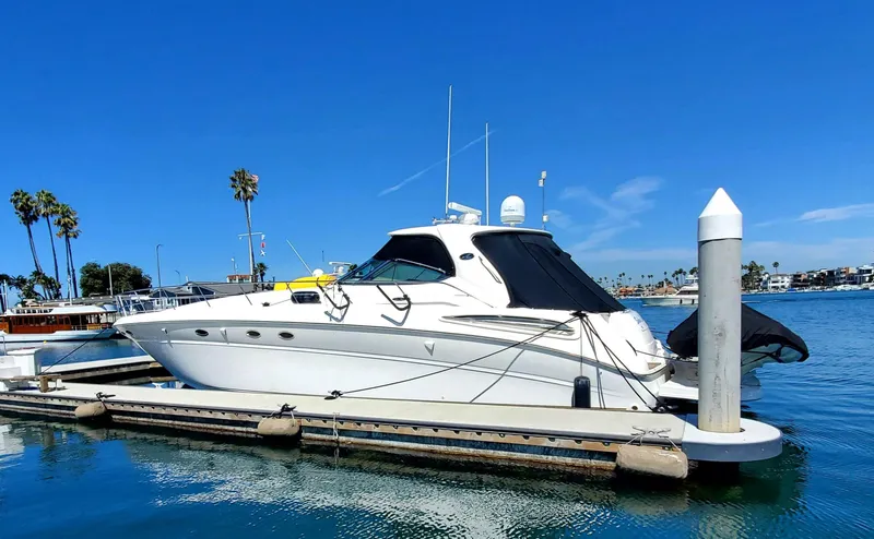 Sunbear Express Yacht Photos Pics 2001 Sea Ray 510 Sundancer yacht docked in sunny marina with clear blue skies.