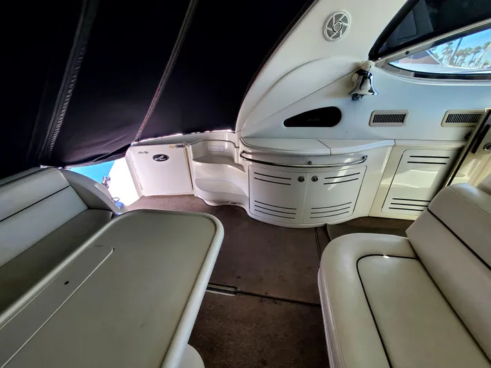 Sunbear Express Yacht Photos Pics Interior of 2001 Sea Ray 510 Sundancer yacht, featuring seating and cabinetry.