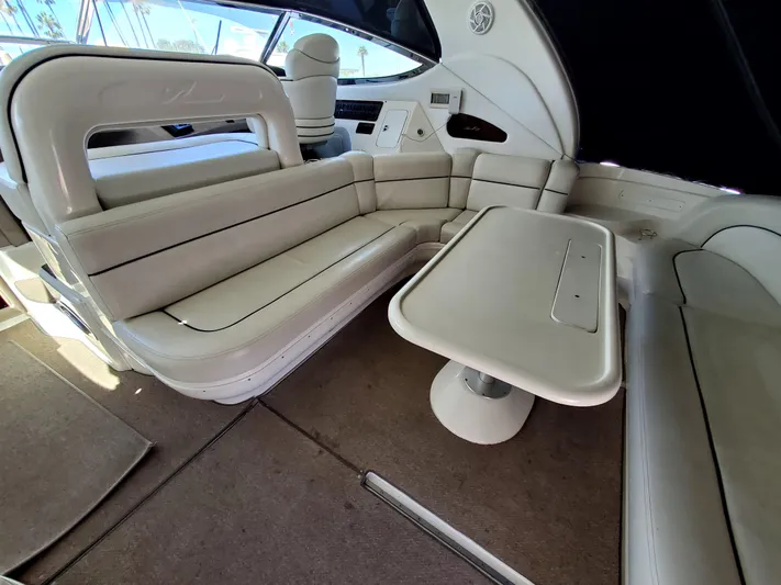 Sunbear Express Yacht Photos Pics Luxurious interior of 2001 Sea Ray 510 Sundancer yacht with plush seating and table.