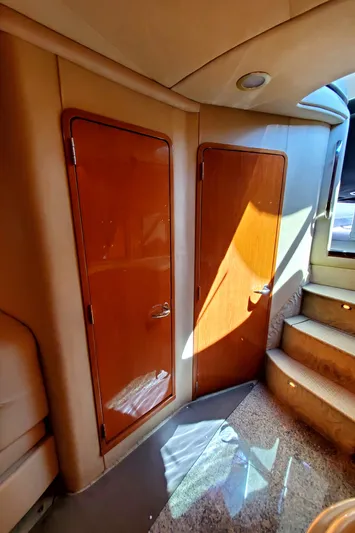 Sunbear Express Yacht Photos Pics Interior of 2001 Sea Ray 510 Sundancer yacht with wooden doors and carpeted stairs.