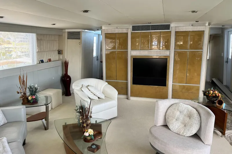 Liquidity Yacht Photos Pics Luxurious 1984 Broward Raised Pilothouse yacht interior with elegant seating and modern decor.