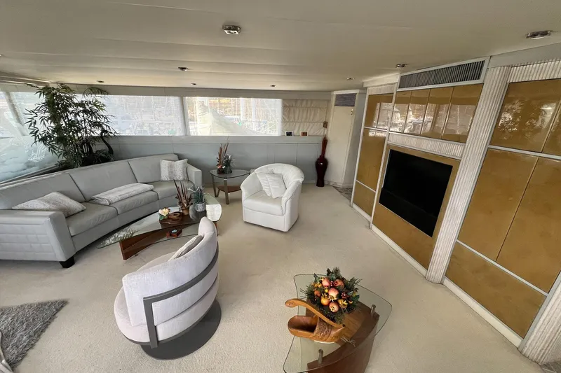 Liquidity Yacht Photos Pics Luxurious 1984 Broward Raised Pilothouse yacht interior with elegant seating and modern decor.