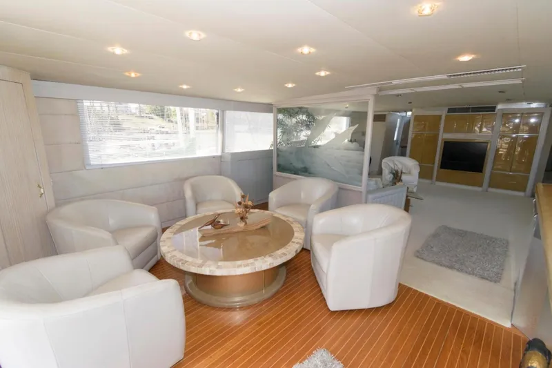 Liquidity Yacht Photos Pics Luxurious 1984 Broward Raised Pilothouse yacht interior with elegant seating and modern decor.