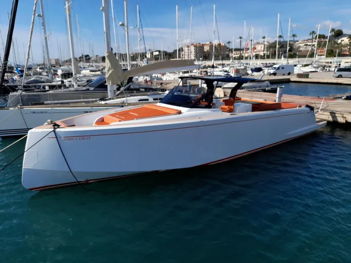  Yacht Photos Pics 2023 Pardo Yachts 50 docked in a marina, showcasing sleek design and luxury features.