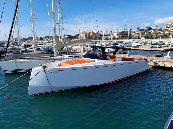  Yacht Photos Pics 2023 Pardo Yachts 50 docked in a marina, showcasing sleek design and luxury features.