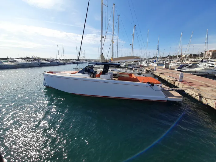  Yacht Photos Pics 2023 Pardo Yachts 50 docked in a sunny marina, surrounded by other boats.