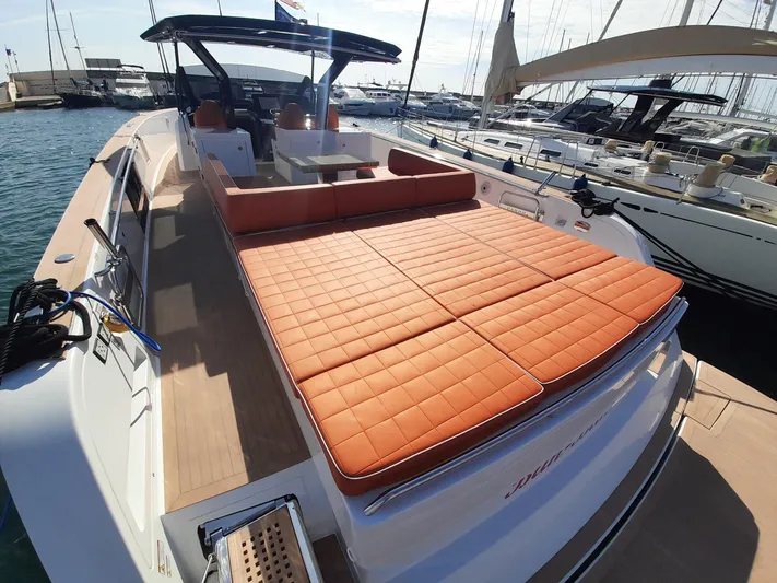  Yacht Photos Pics 2023 Pardo Yachts 50 with spacious sun deck and luxurious seating at marina.