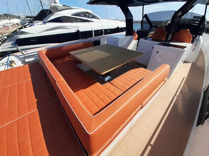  Yacht Photos Pics Luxurious 2023 Pardo Yachts 50 with orange seating and sleek design at marina.