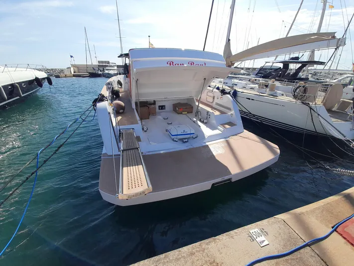  Yacht Photos Pics 2023 Pardo Yachts 50 docked at marina, showcasing sleek design and spacious deck.