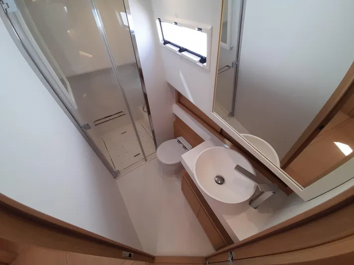  Yacht Photos Pics Modern bathroom interior on 2023 Pardo Yachts 50, featuring sleek fixtures and a shower.