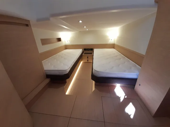  Yacht Photos Pics Luxurious cabin interior of 2023 Pardo Yachts 50 with twin beds and modern lighting.