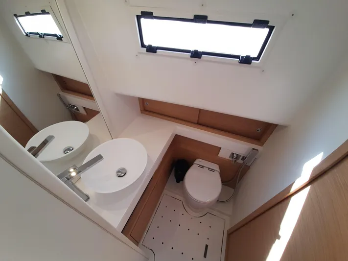  Yacht Photos Pics Modern bathroom in 2023 Pardo Yachts 50, featuring sleek sink and toilet design.