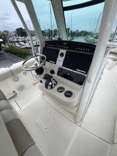  Yacht Photos Pics 2020 Boston Whaler 280 Outrage helm with modern controls and steering wheel.