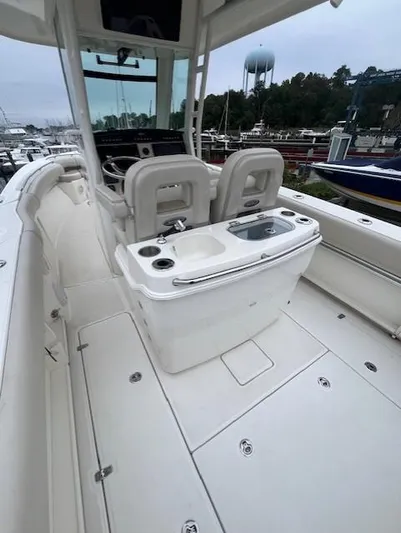  Yacht Photos Pics 2020 Boston Whaler 280 Outrage boat interior with seating and console.