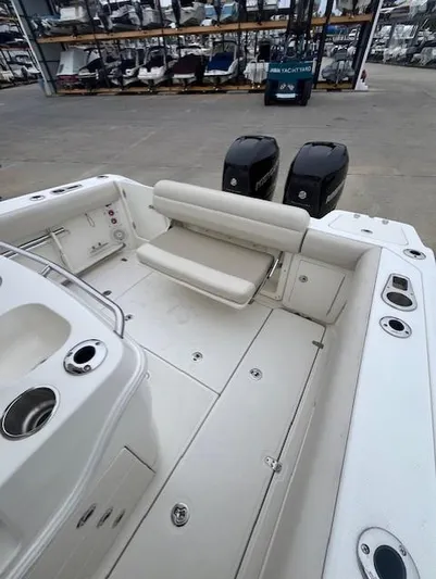  Yacht Photos Pics 2020 Boston Whaler 280 Outrage boat interior with seating and dual engines.