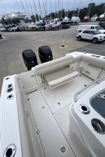  Yacht Photos Pics 2020 Boston Whaler 280 Outrage boat with dual engines at a marina.