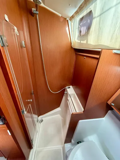 Wanderer Yacht Photos Pics 2019 Beneteau Oceanis 41.1 yacht bathroom with wooden finish and modern shower.