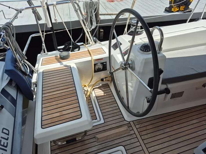 Wanderer Yacht Photos Pics Cockpit of 2019 Beneteau Oceanis 41.1 sailboat with wooden seating and steering wheel.